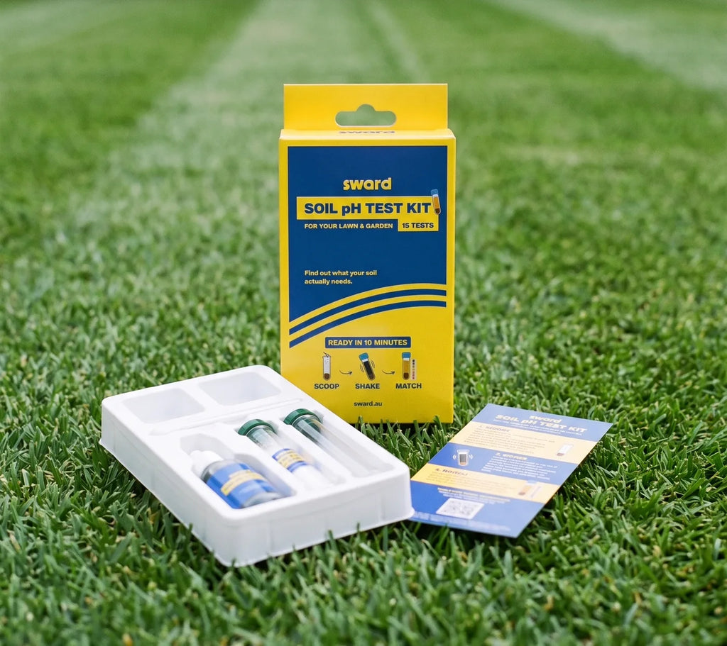 Sward Soil pH Test Kit contents on a lawn: the box, the tray of solutions and tubes, and the colour chart card